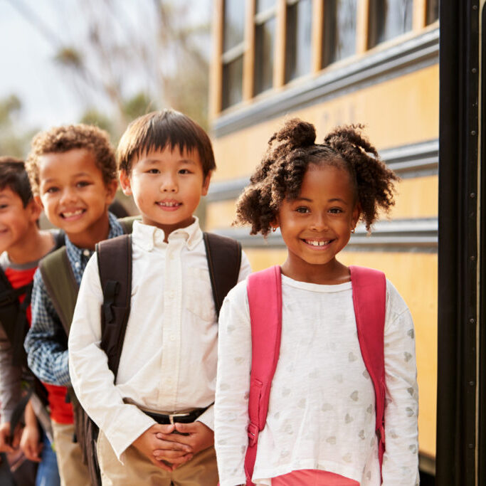 Photo: Students boarding a school bus